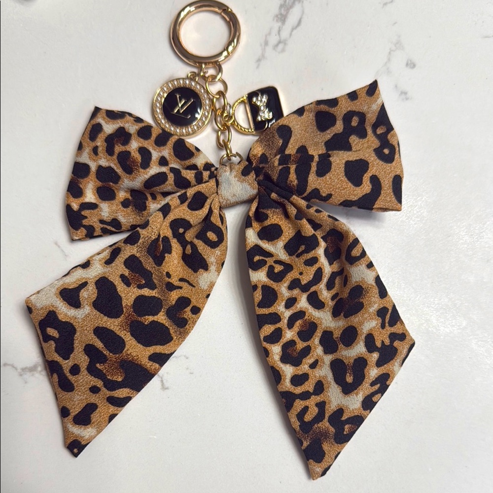 LV up cycled charm made into a cute  Leopard Print Bow Keychain/purse charm.